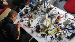 A geek soldering at the CCC